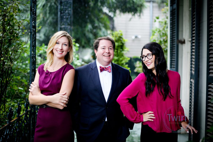 Three attorneys on a New Orleans balcony for a professional portrait.