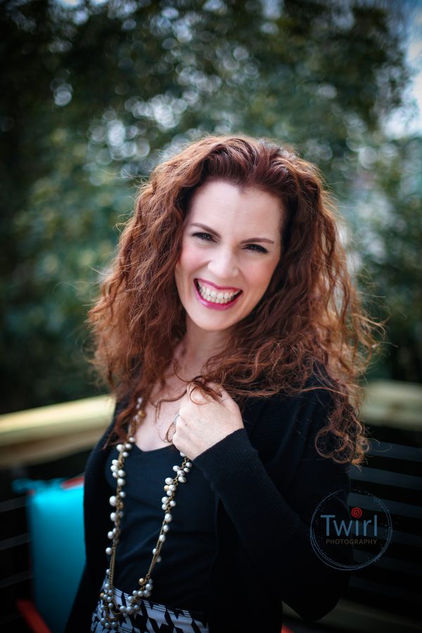 A woman posing for a professional portrait in New Orleans.