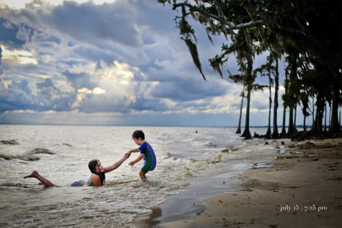 Two kids in the water at fourntainbleu state park.