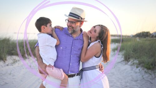 Dad with two kids posing for a photo in Bay St. Louis, MS