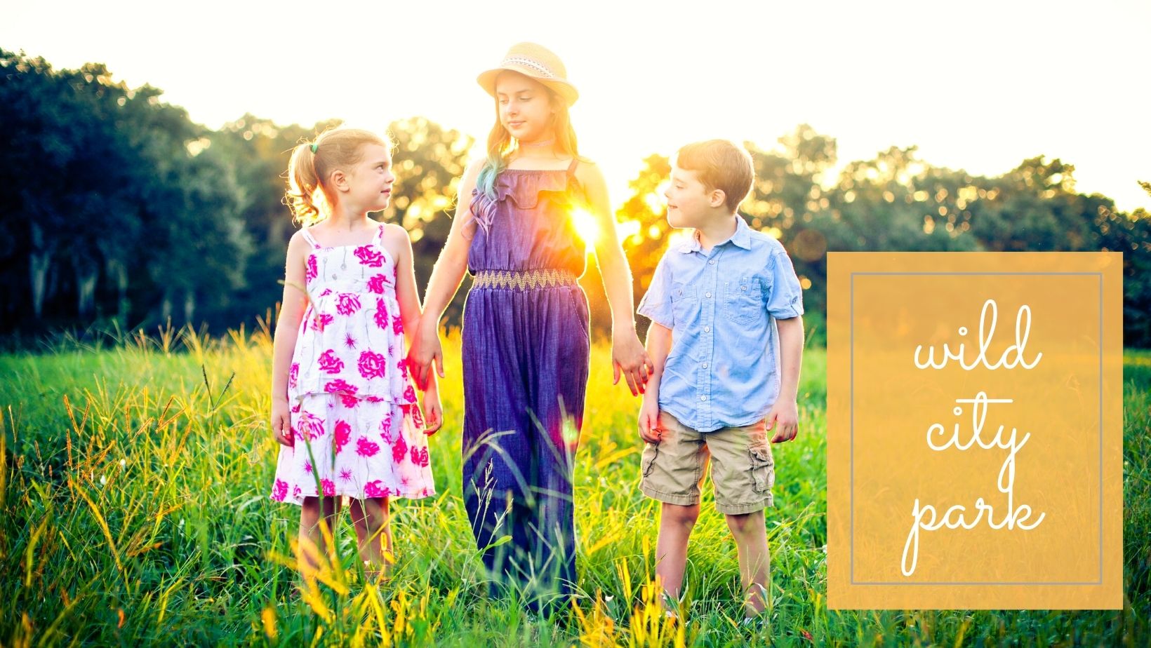 Three siblings holding hands in City Park for a location guide story on the Best Spots in New Orleans for Family Photos by Twirl Photography.