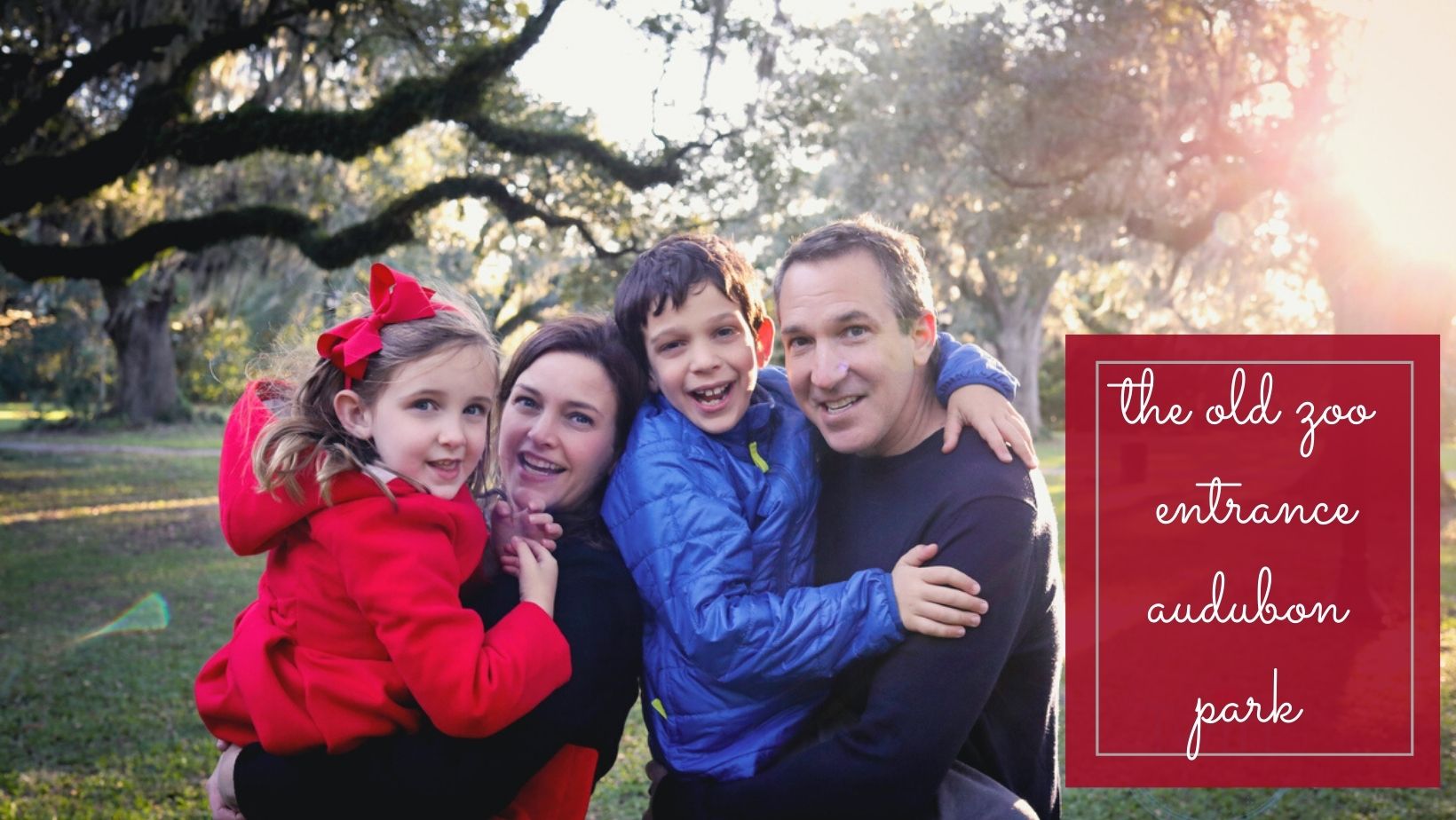 A family smiling at the camera under oak trees in Audubon Park for a location guide story on the Best Spots in New Orleans for Family Photos by Twirl Photography.