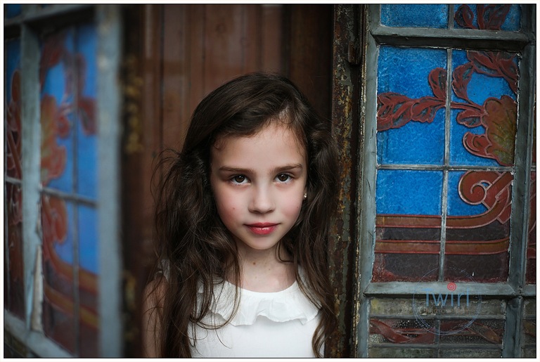 A young girl poses for portraits at Race and Religious, a historic home in New Orleans.