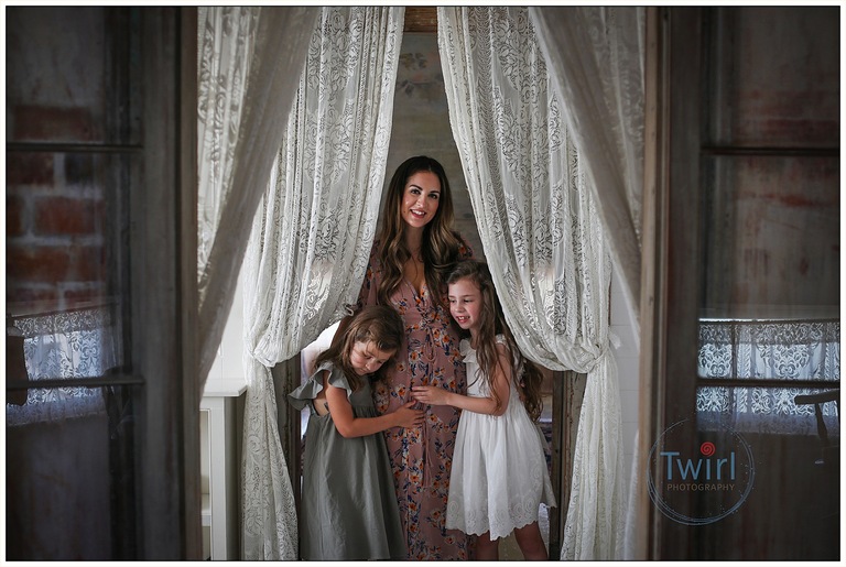 Two young girls and their mom pose for portraits at Race and Religious, a historic home in New Orleans.