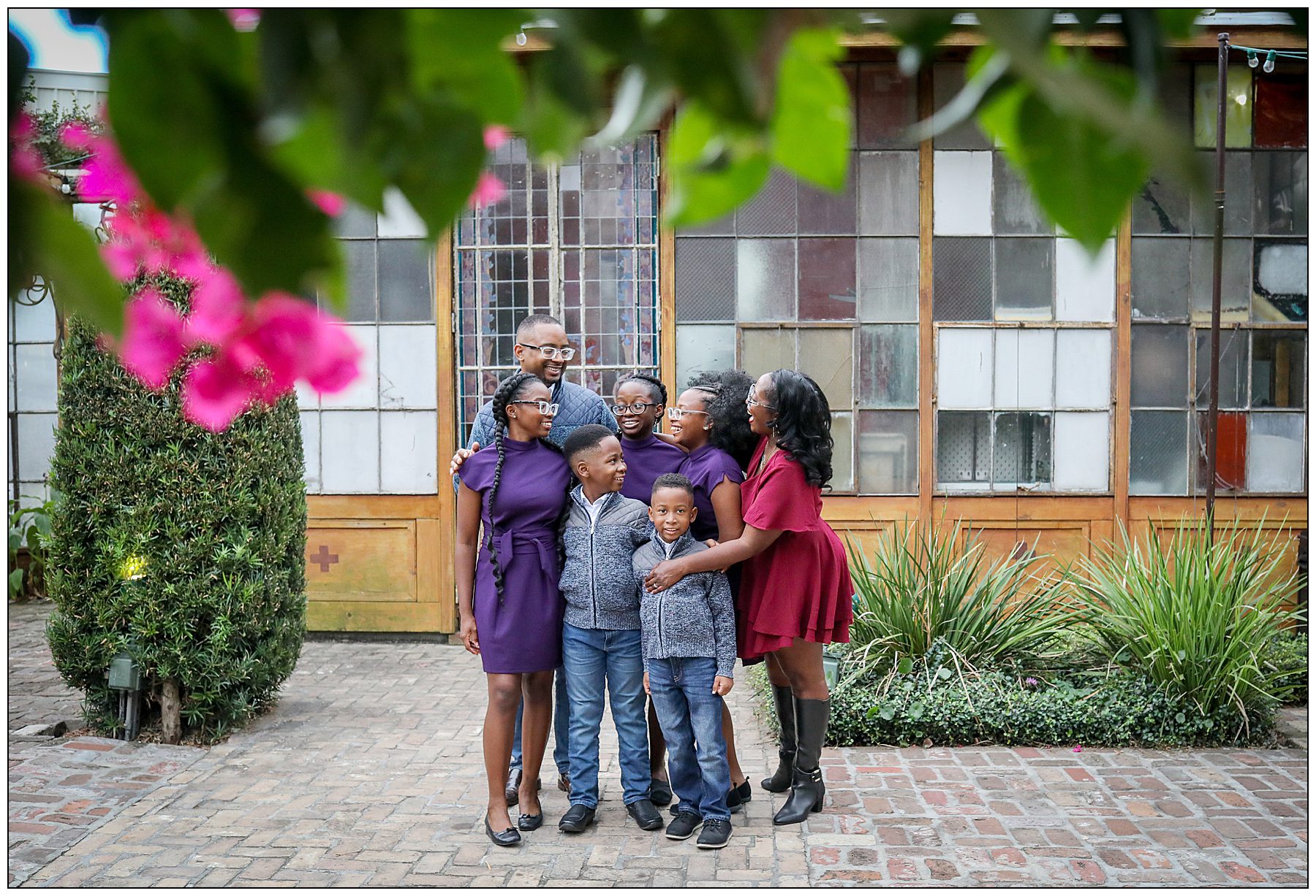 A family of 7 at Race and Religious hugging each other during a fall mini session.