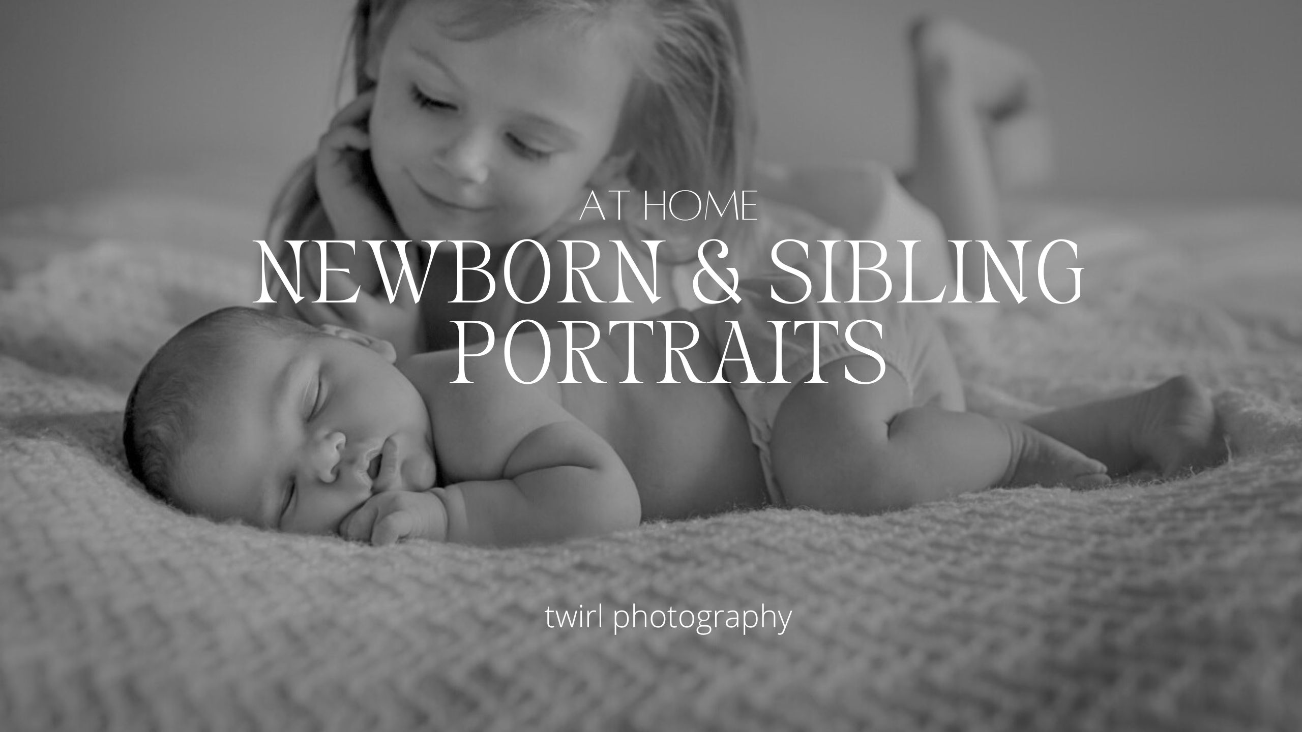 A little girl leaning over a newborn baby and smiling as she looks at her baby sister during newborn photos at their home in New Orleans for how to include older siblings in newborn photos.