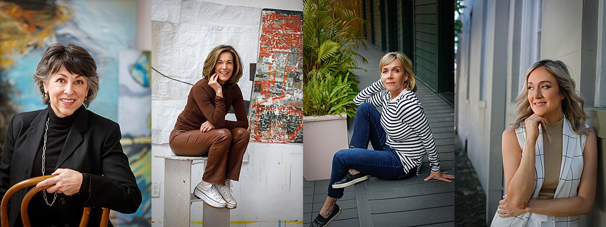 Several professional women posing for a headshot as they sit and work in New Orleans.