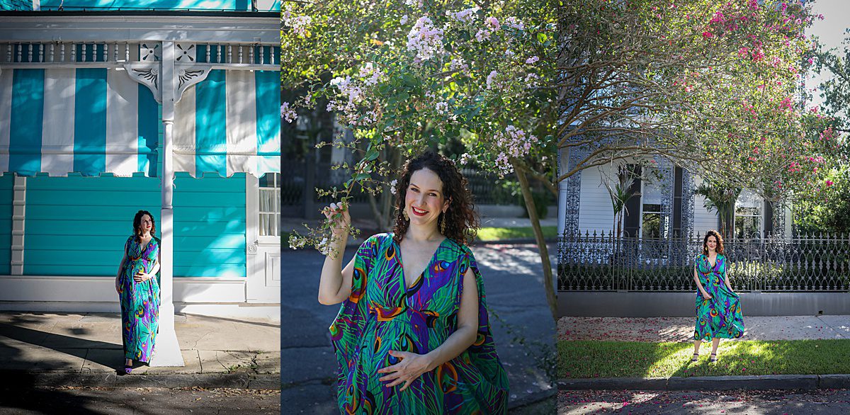 A woman in a peacock print maternity dress posing at the camera in New Orleans.