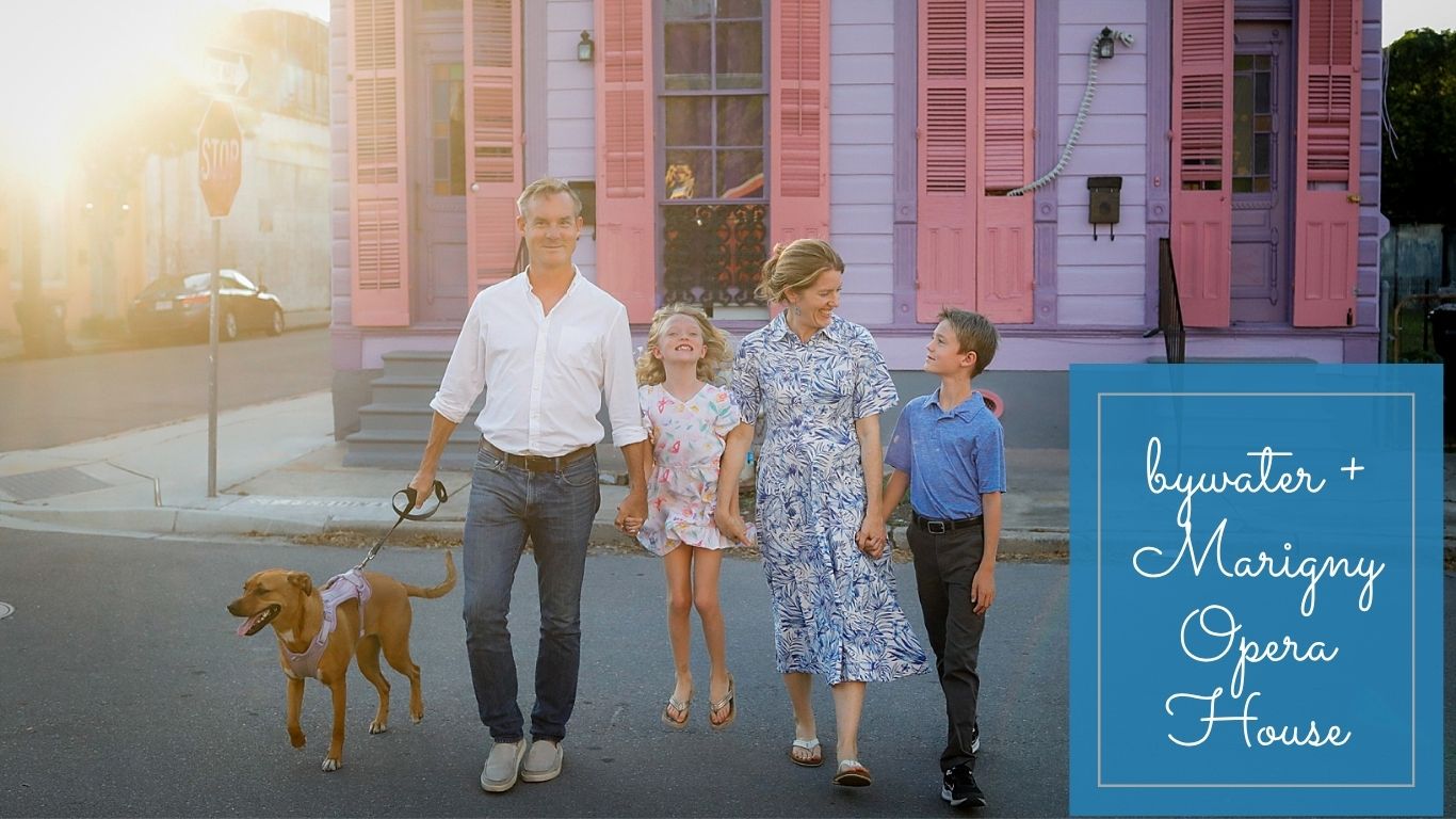 A family walking with a dog in the Bywater.