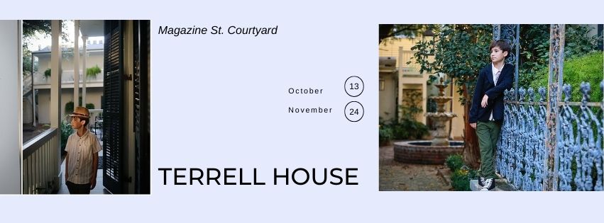 A boy standing on a porch at the Terrell House for fall mini photos in New Orleans.