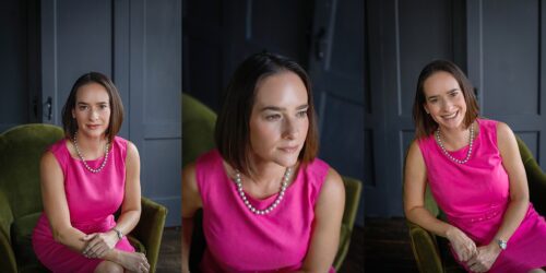A woman wearing a pink dress with no sleeves sitting on a green velvet chair posing for New Orleans Headshots.