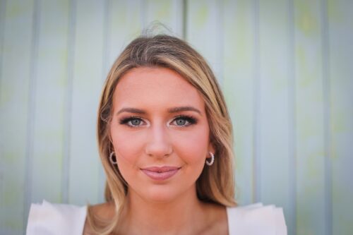 a woman smiling at the camera