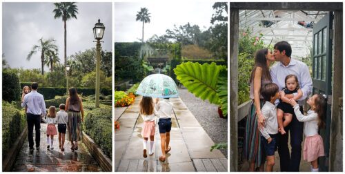A family of four hugging and walking together in the New Orleans Botanical Gardens.