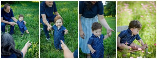 A little toddler boy taking wobbly steps towards his mom in a garden of flowers.