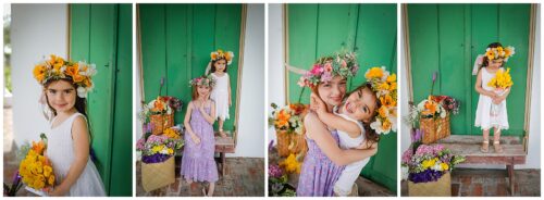 Two sisters in flower crowns hugging in front of a green wall in New Orleans.