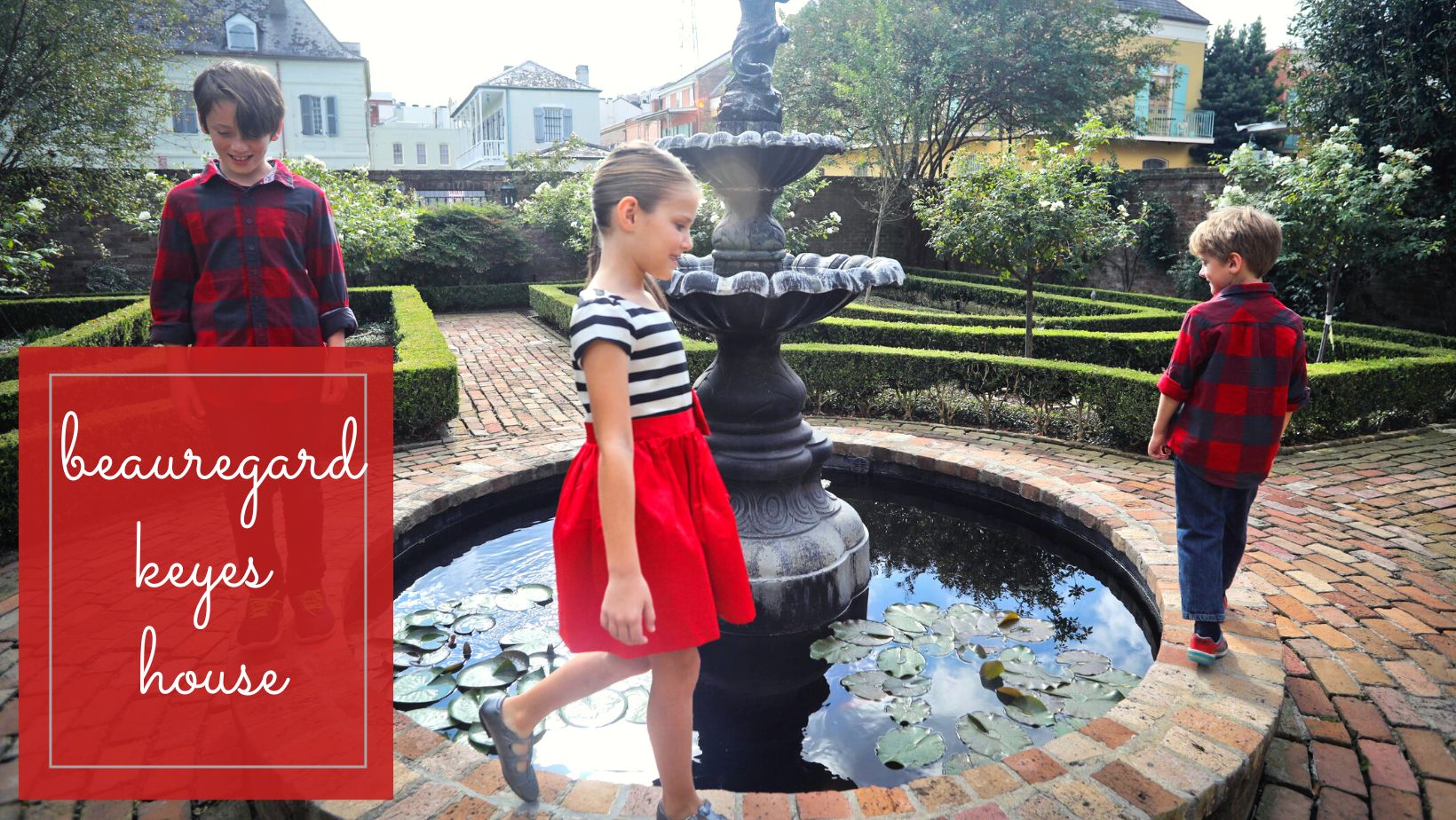 A family circling a fountain in a private New Orleans French quarter courtyard.