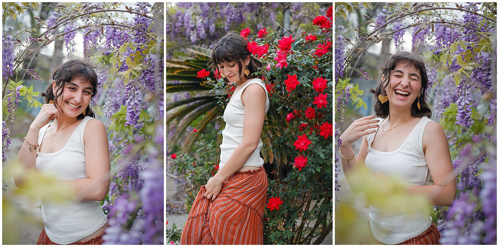 A senior posing for pictures surrounded by purple and red blooms.