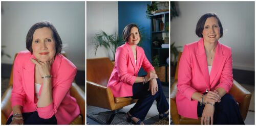 A woman in a pink blazer sitting for a headshot in New Orleans.